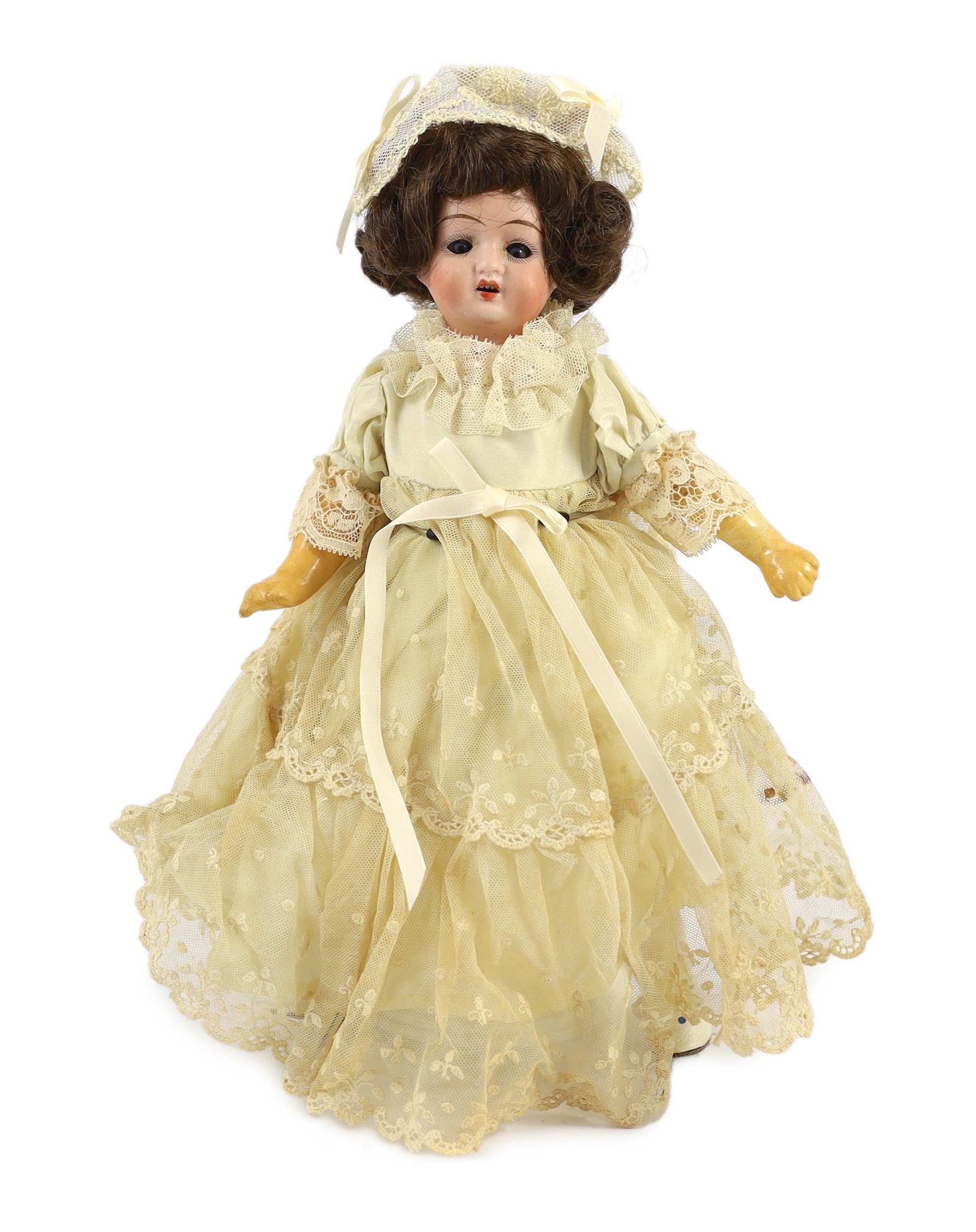 A bisque doll, probably by Gebruder Kuhnlenz, German, circa 1891, 11in.